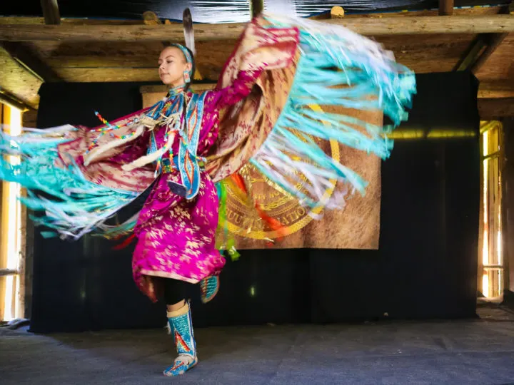 A young Tsuut'ina woman performs a traditional dance at Spotted Elk Camp in Calgary, Canada.