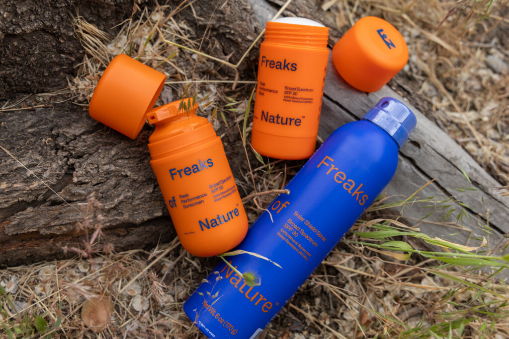 Freaks of Nature Sunscreen options sprawled out on the ground.