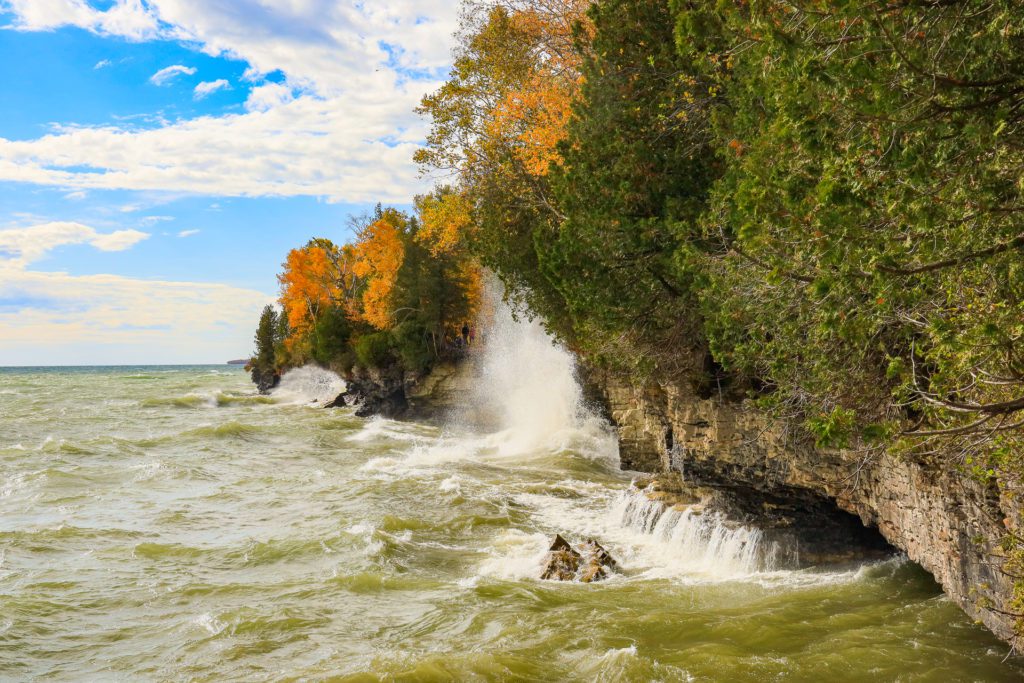 A view of the waves crashing into the caves and coastline at Cave Point County Park in Door County, Wisconsin.