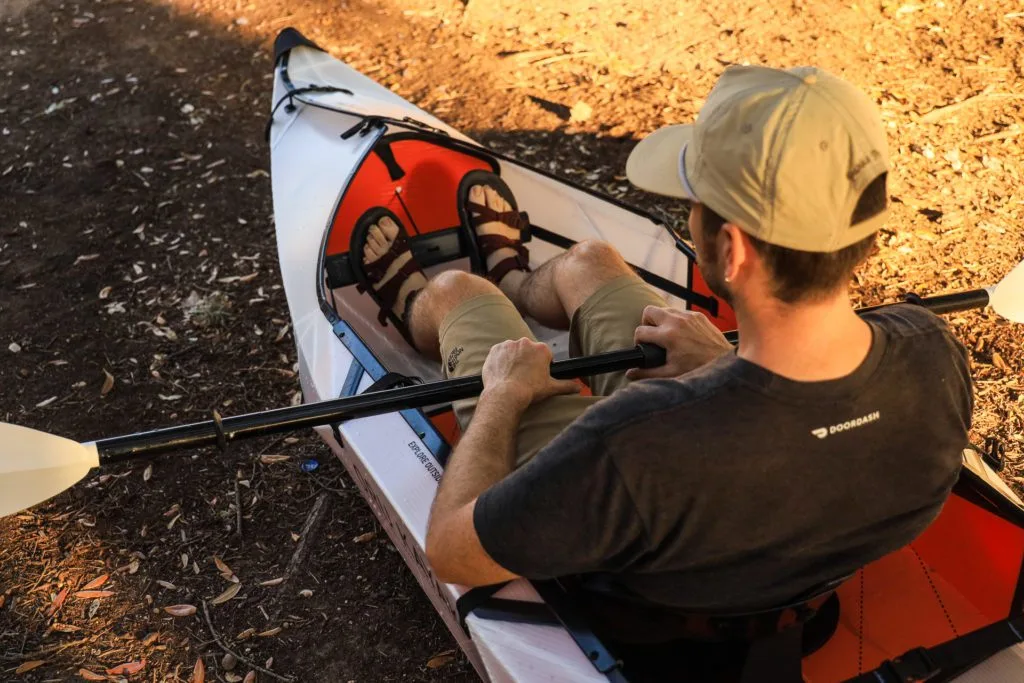 Josh setting up the adjustable paddle and footrest before launching.