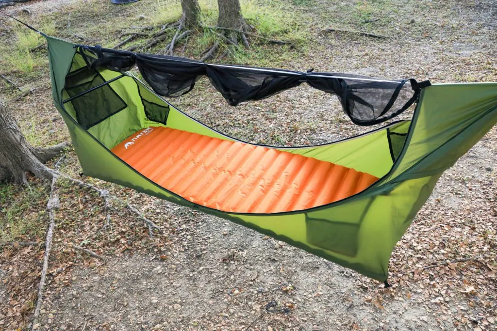 The Haven Tent lay-flat camping hammock setup, integrated bug net unzipped and rolled up.