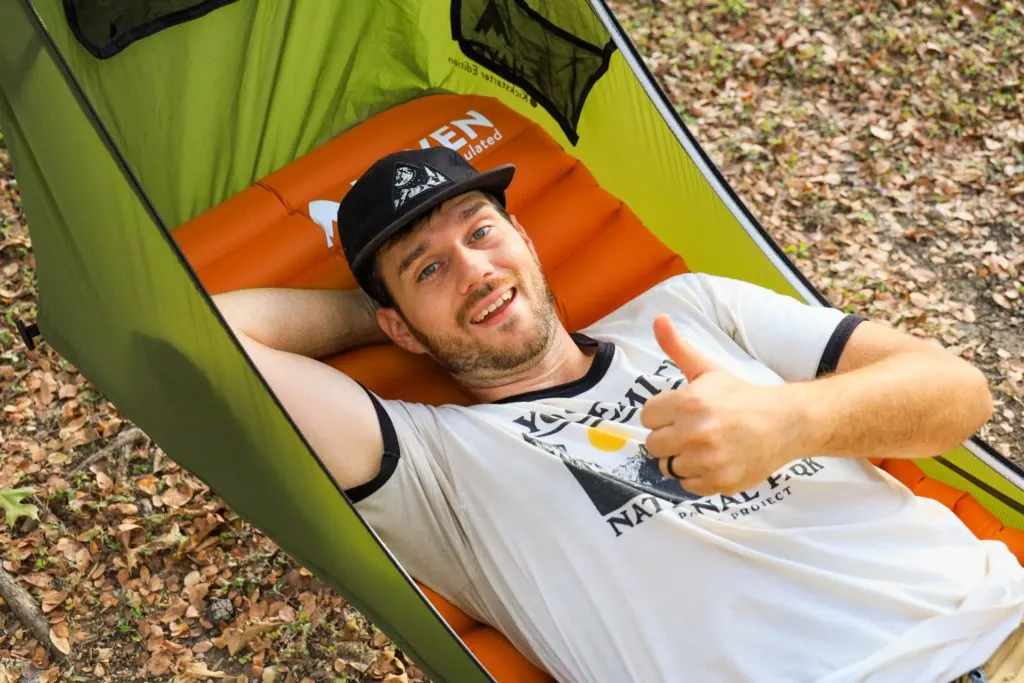 Josh gives a thumbs up from inside the Haven Tent camping hammock.