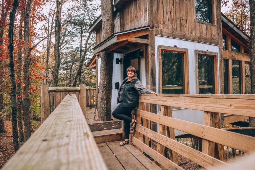 Ashley of Wild Hearted in a treehouse.