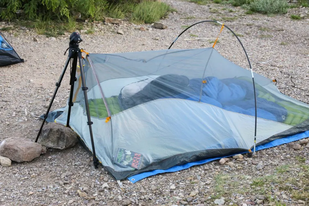 Pitching a tent without tent poles.