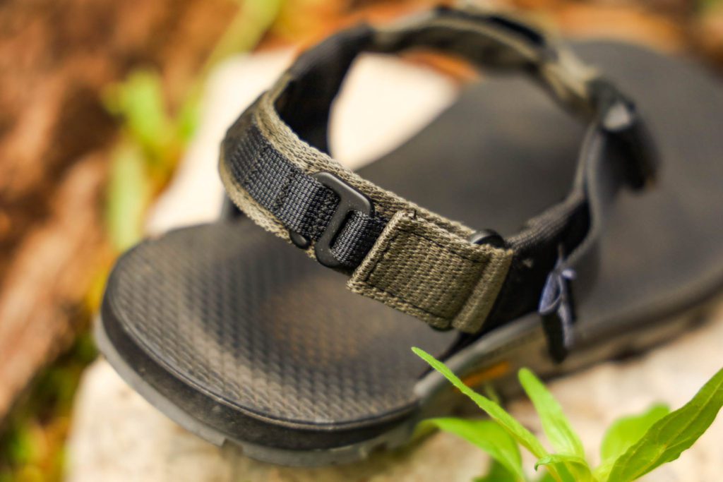 A close up of the G hook and loop straps on the heel of the Bedrock Cairn Pro II Adventure Sandals.