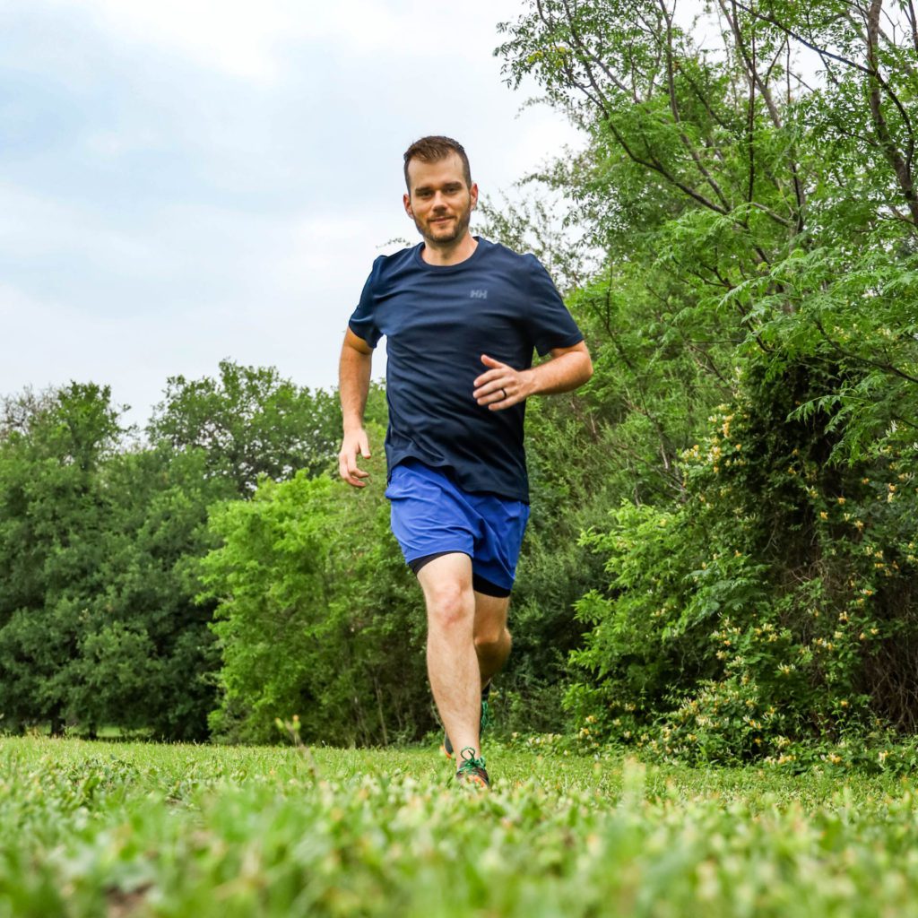 Josh running in the sustainable Helly Hansen Lifa Solen short sleeve shirt.