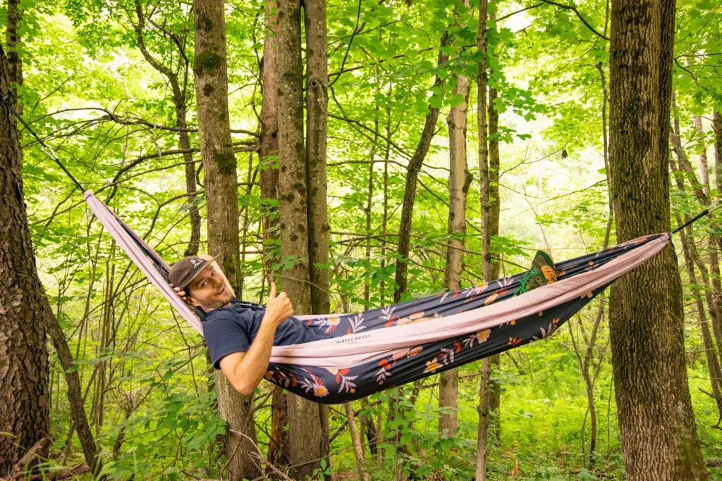 Josh hanging in a Coalatree Hammock.