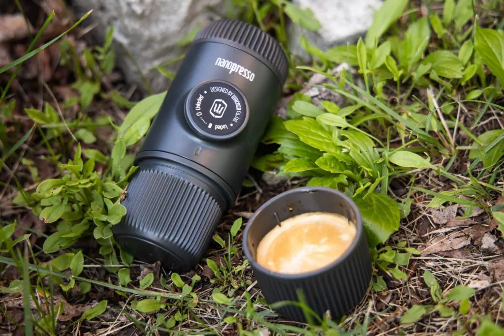 The Wacaco Nanopresso portable espresso maker with a cup of well-made espresso.
