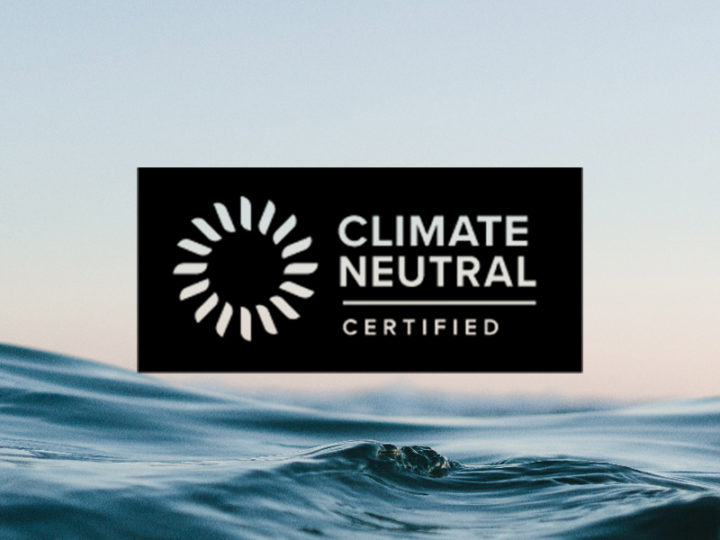 climate neutral logo on an ocean background.