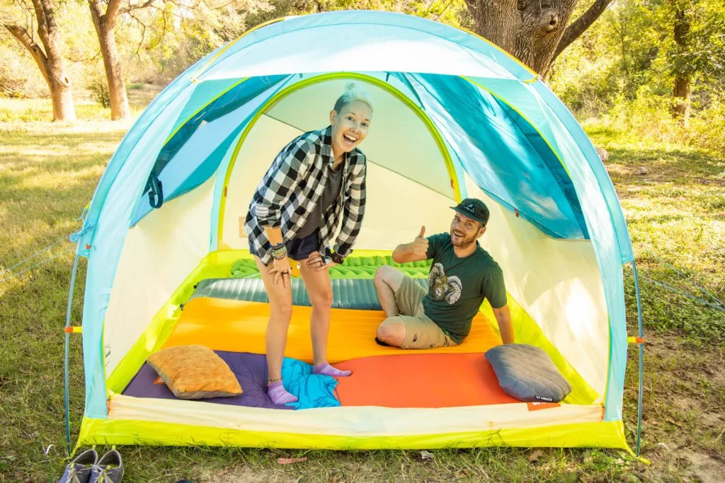 UST House Party 4 Review: two people hanging out inside a tent.