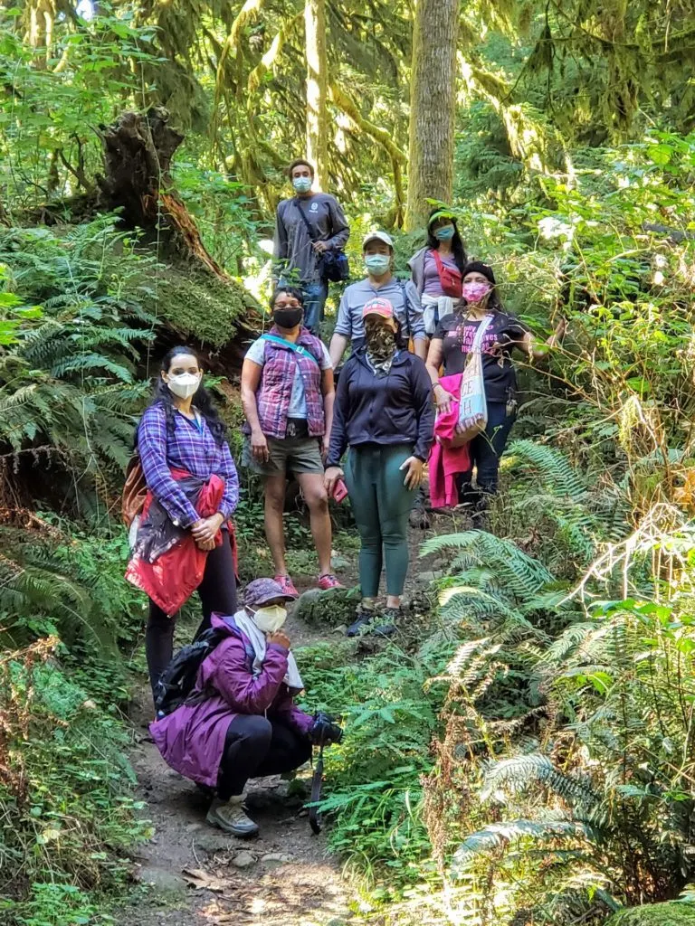 Photo by Pamela Slaughter: A group of hikers on a trail at Oxbow's ancient forest.