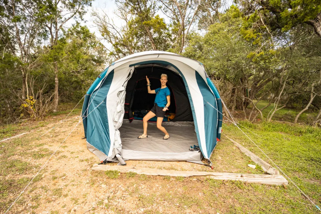 A woman in the interior of the Decathlon Fresh and Black Air Seconds inflatable tent.