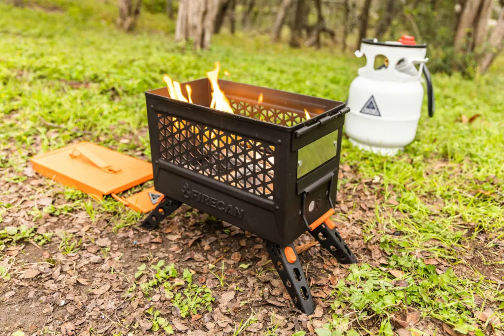 The Ignik FireCan hooked up to the Gas Growler with flames ablaze.