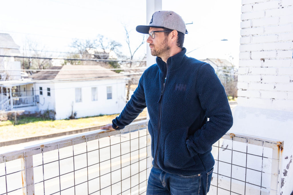 Josh in the navy blue Helly Hansen Panorama Pile fleece jacket.