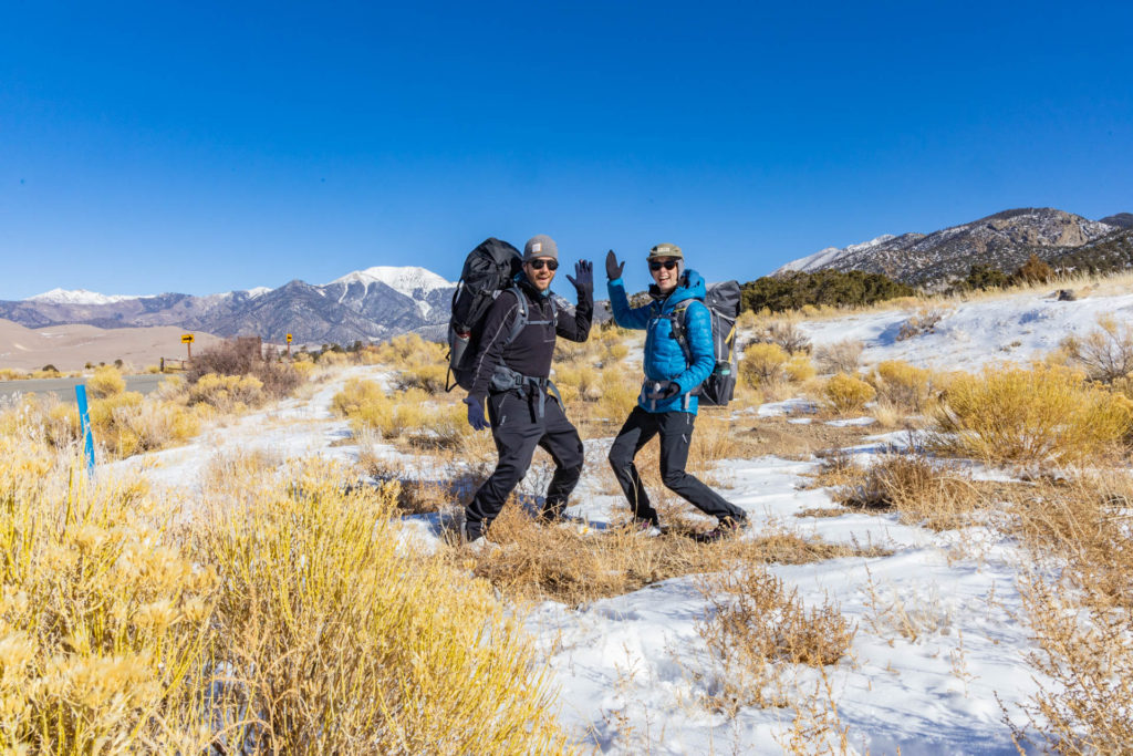 A couple Winter backpacking in Great Sand Dunes National Park.