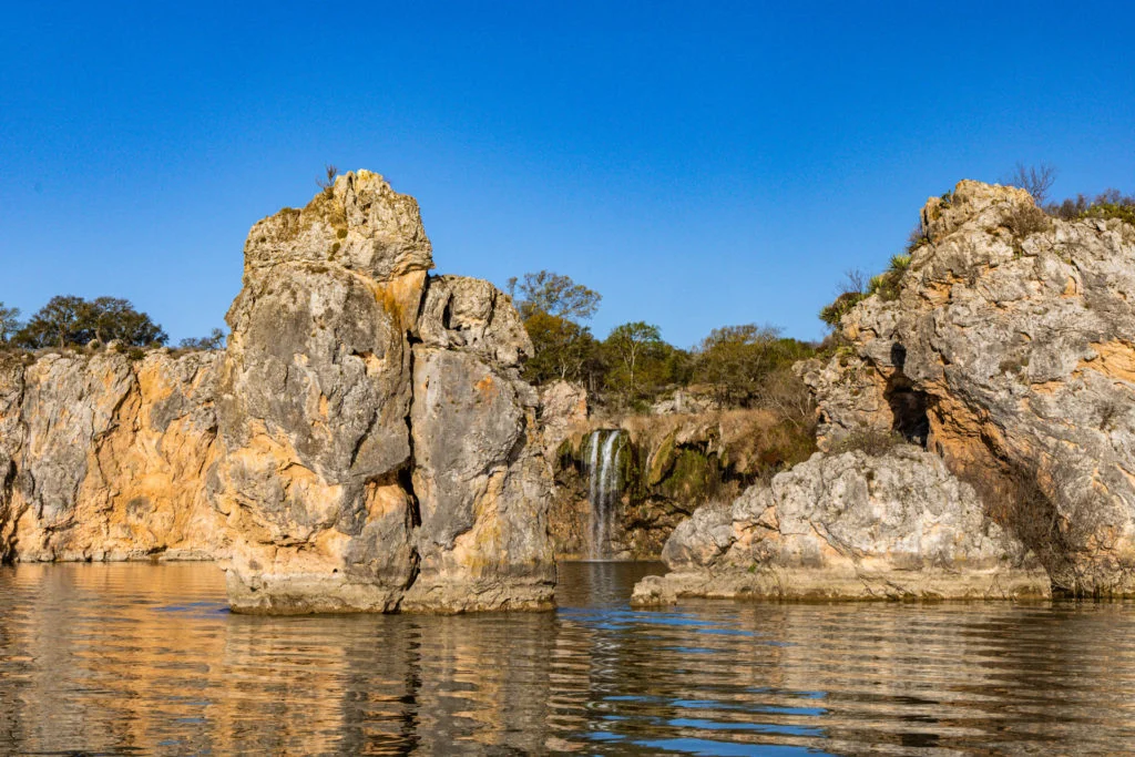 A waterfall on the Vanishing Texas River Cruise on Lake Buchanan.