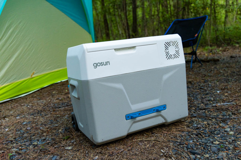 The GoSun Chill electric cooler in front of a tent.