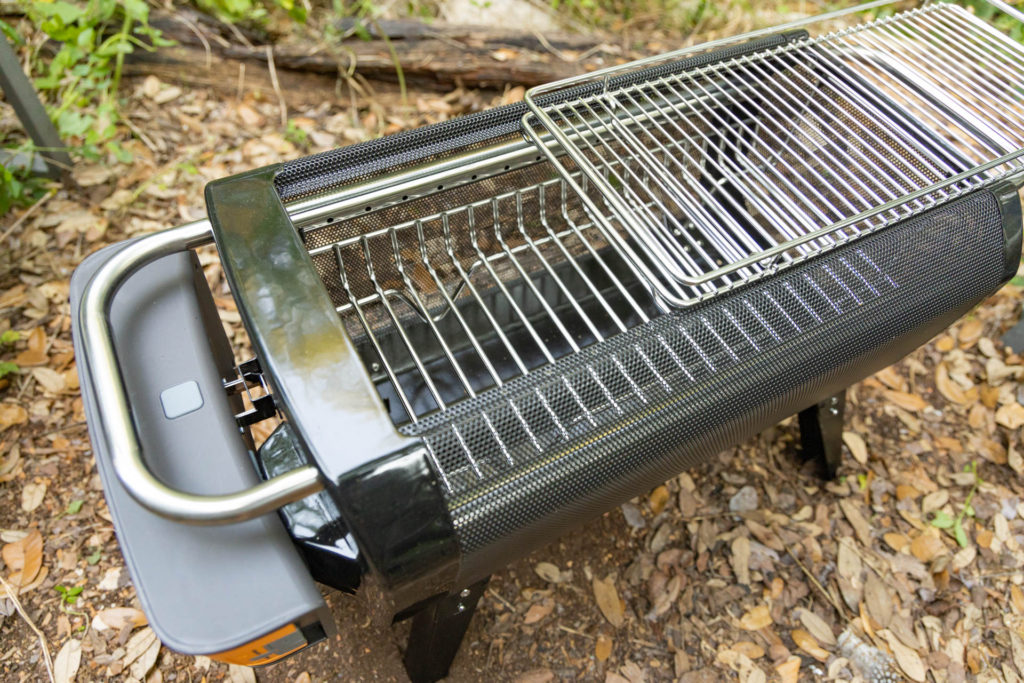 The sliding grill top on the BioLite FirePit+ smokeless fire pit.