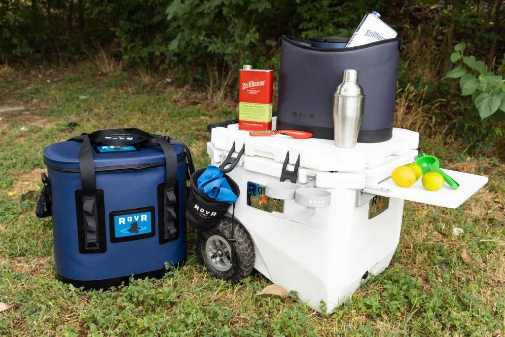 A camp cocktail setup featuring the RovR TravelR, RollR and KeepR plus Stillhouse whiskey and cocktail fixings.