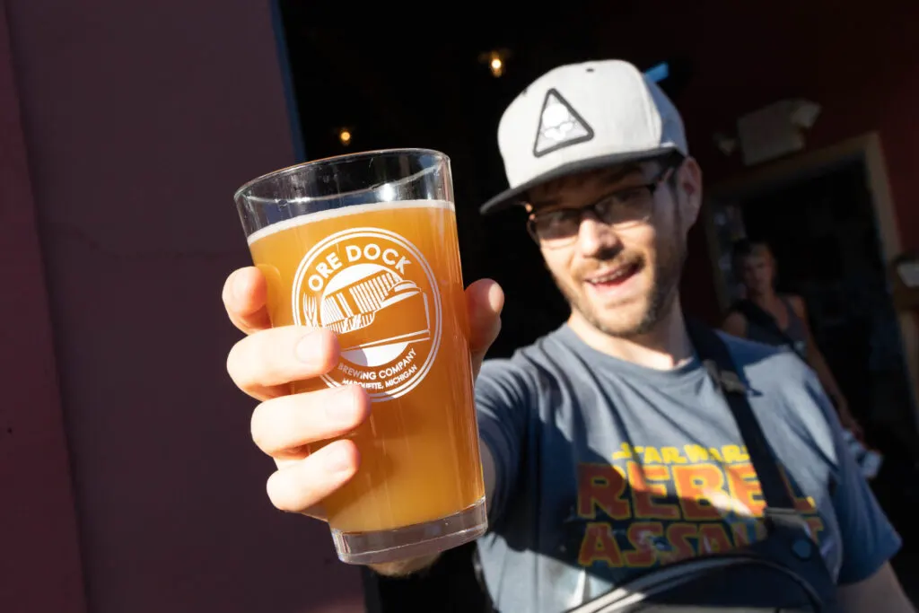 Josh with a beer from Ore Dock Brewing.