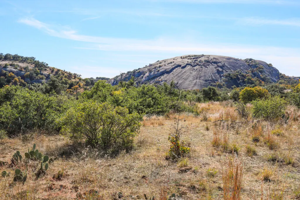 Hiking near Fredericksburg: A view of Enchanted Rock from the loop trail.