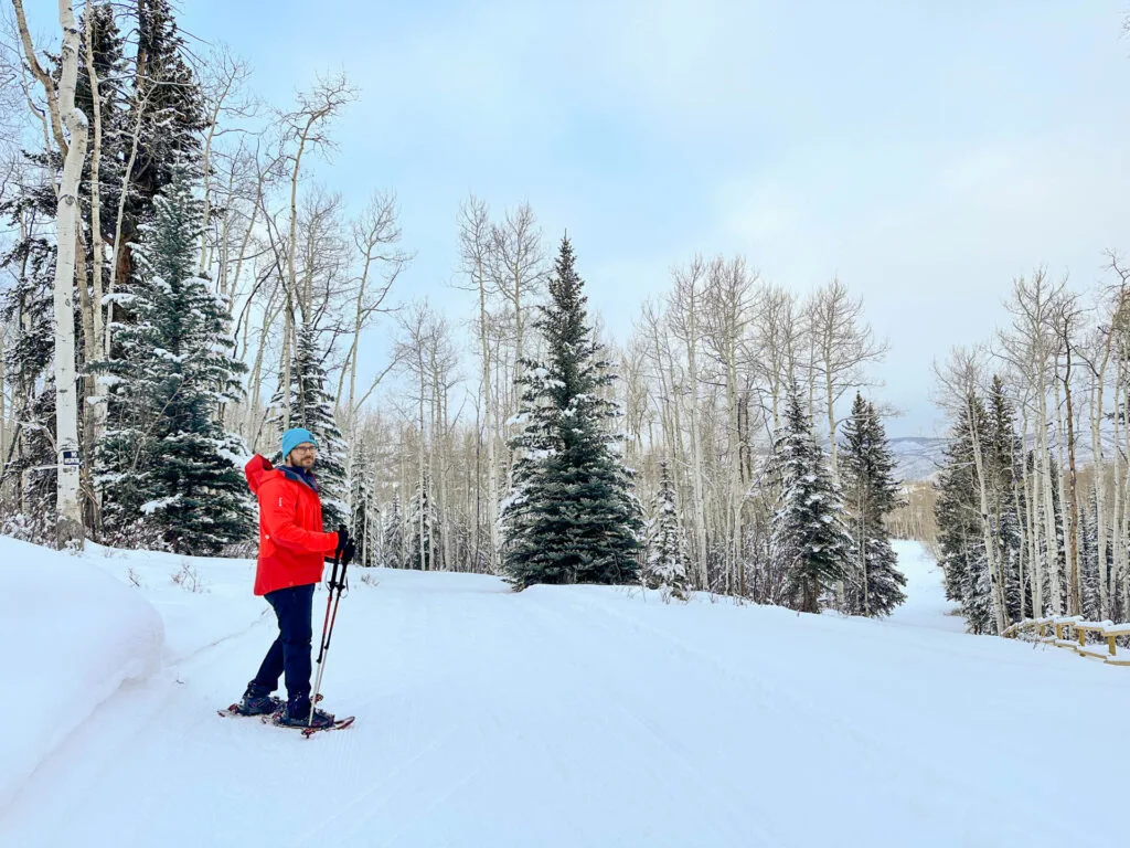 A man snowshoeing on the Aspen Snowmass Trail System