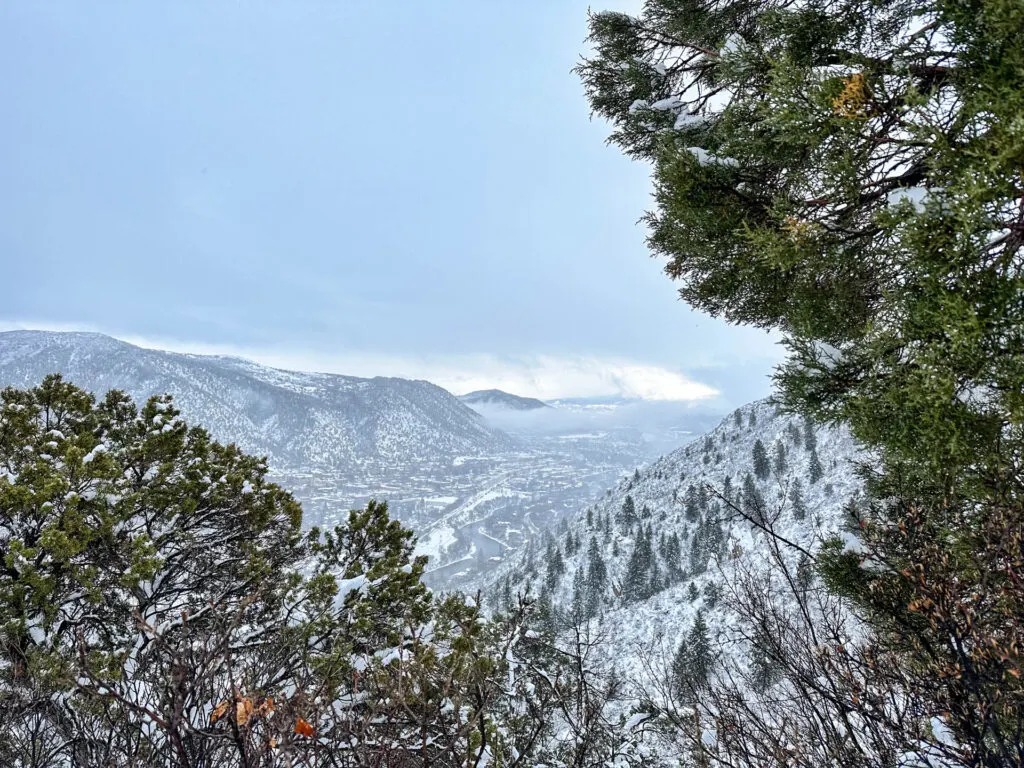 A wintery view of mountains and valleys from Red Mountain in Glenwood Springs, Colorado.