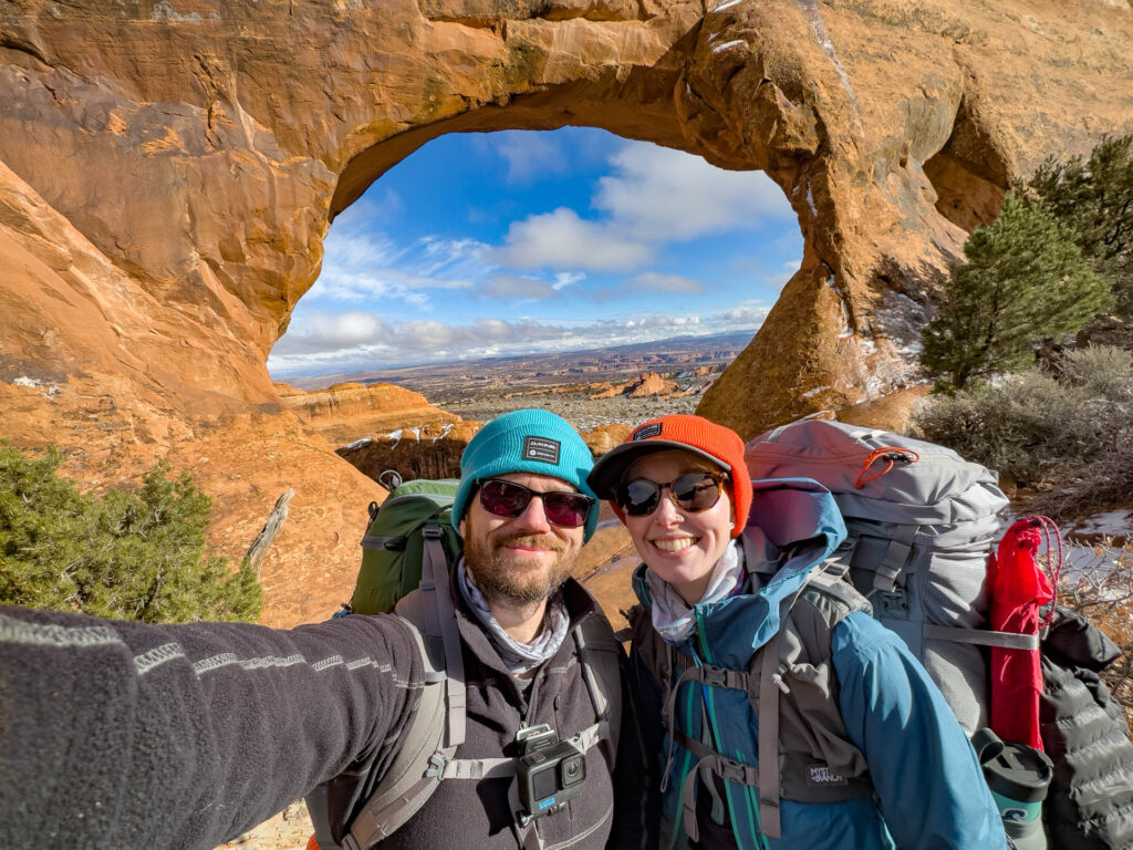 Alisha and Josh winter backpacking in Arches National Park.