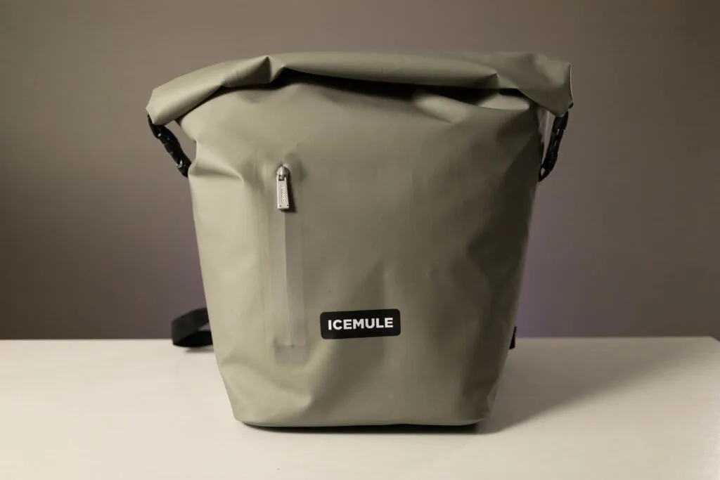The Icemule R-Jaunt backpack cooler sits on a table.