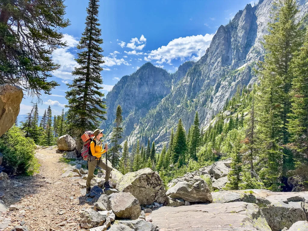 A woman Taking in the view on Death Canyon Trail in Grand Teton NP.