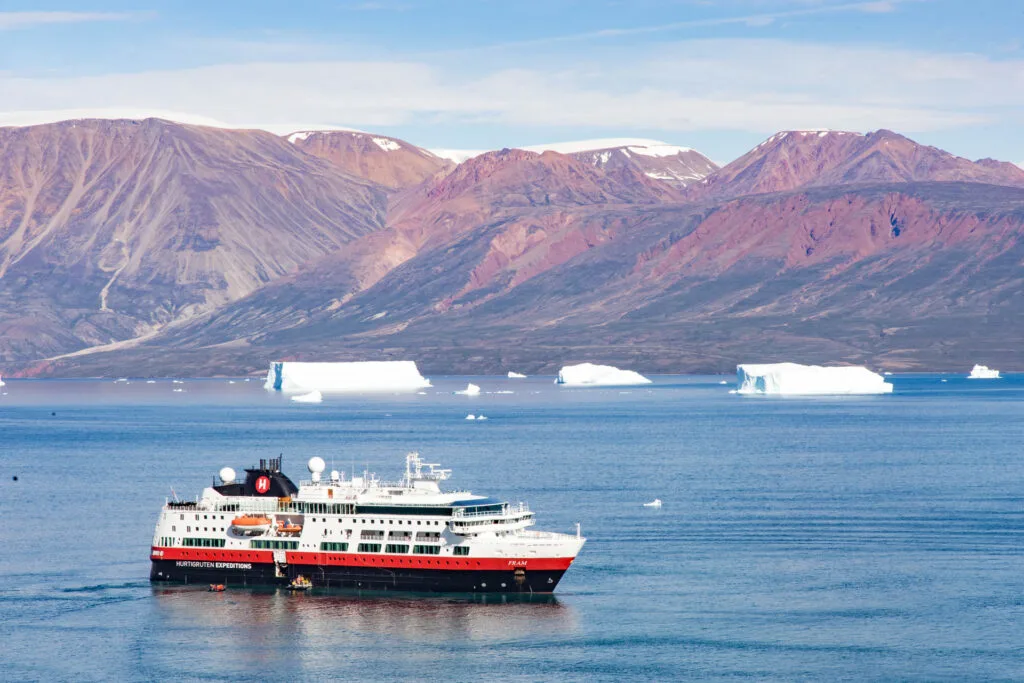 The MS Fram floating in a Fjord.