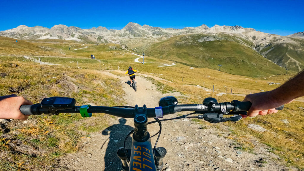 A view over handlebars downhill biking at Corviglia in Celerina, Switzerland.