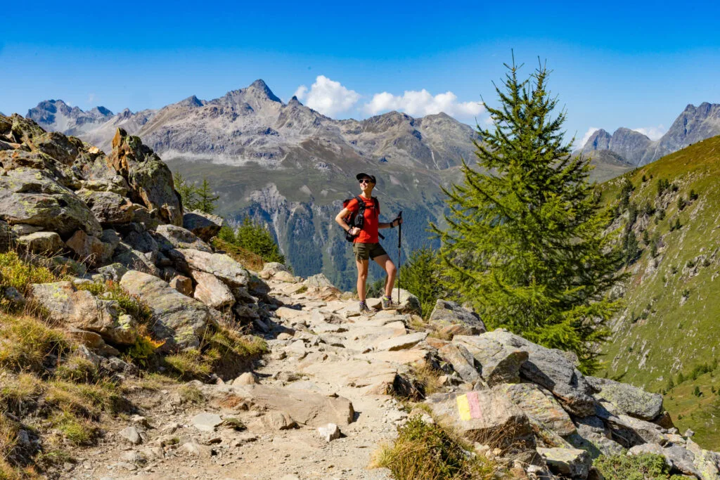 A woman hikes in the mountains in Switzerland.