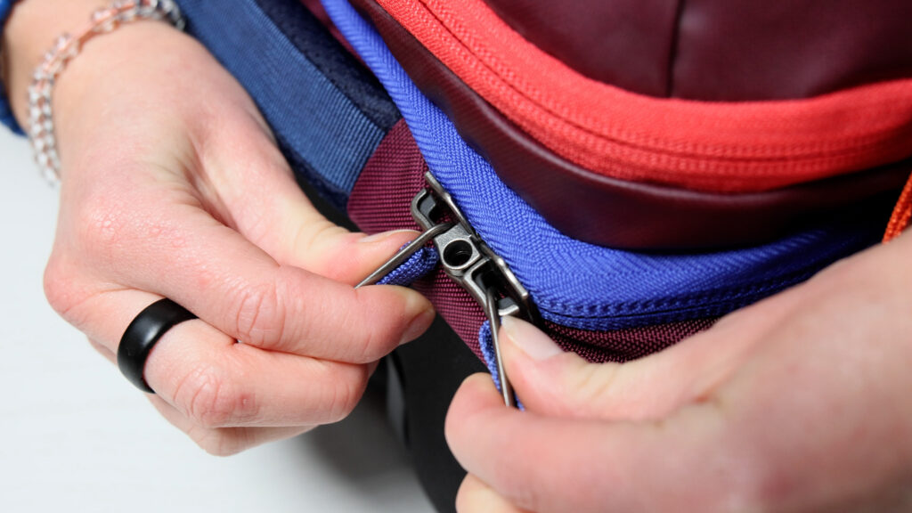 You can add a lock to the main zippers on the Cotopaxi Allpa Roller Bag.