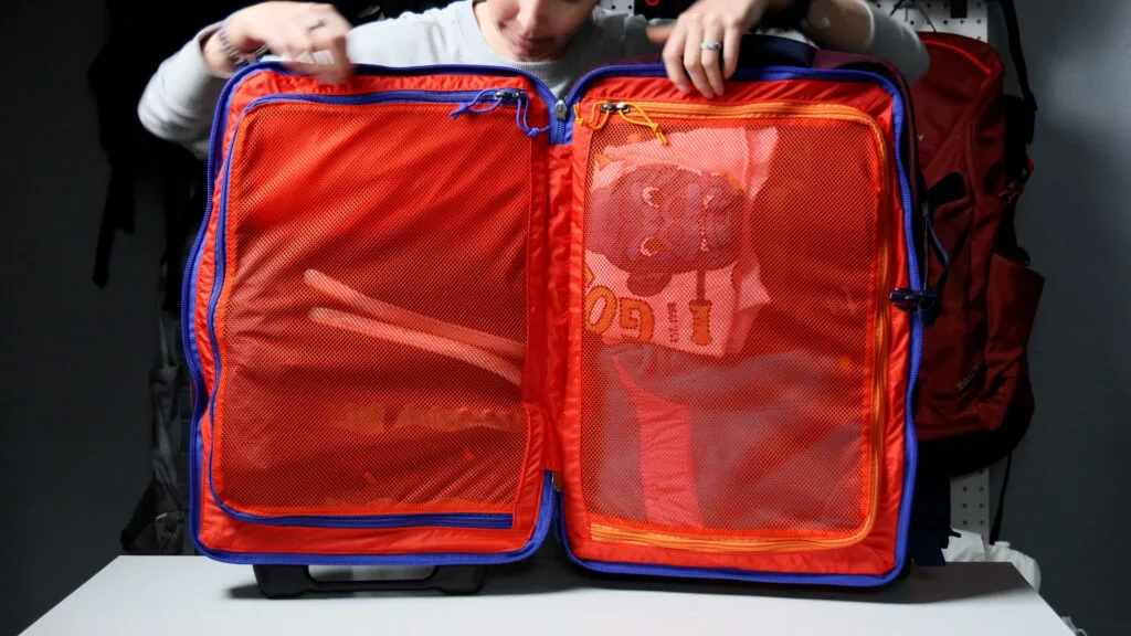 The interior of the Cotopaxi Allpa Roller Bag carry-on luggage.