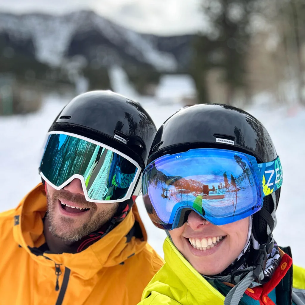 A man and woman in ski apparel smile  at Lee Canyon in Las Vegas.