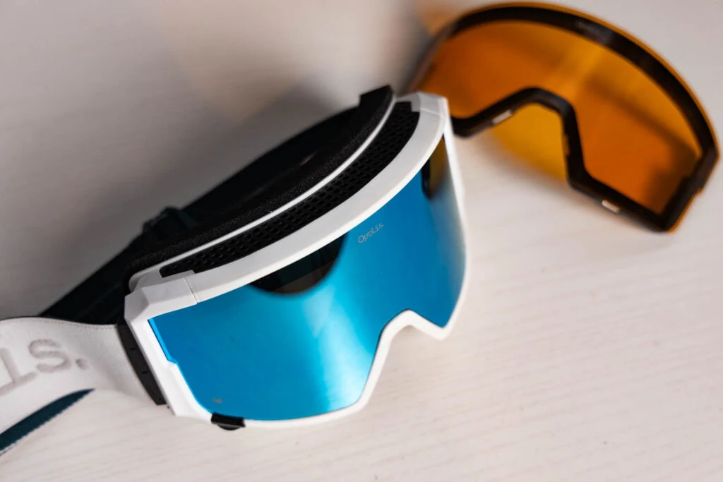 The Opolis Ski and Snowboard Goggles in White Out with the included low-light lens.