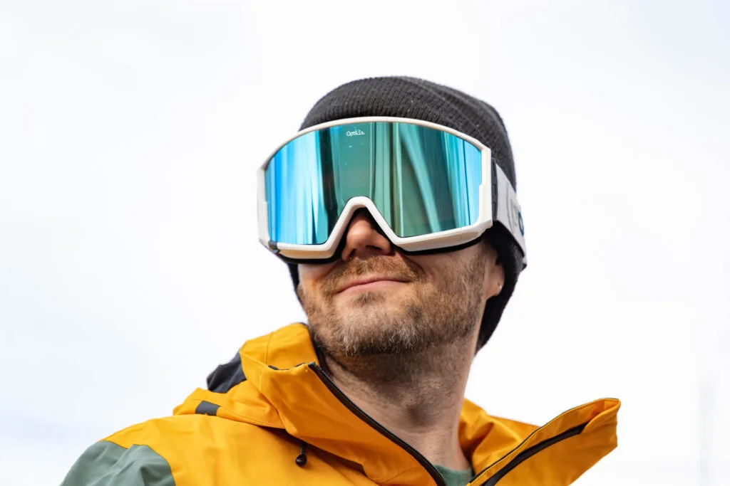 a man wears The Opolis sustainable Ski and Snowboard Goggles.