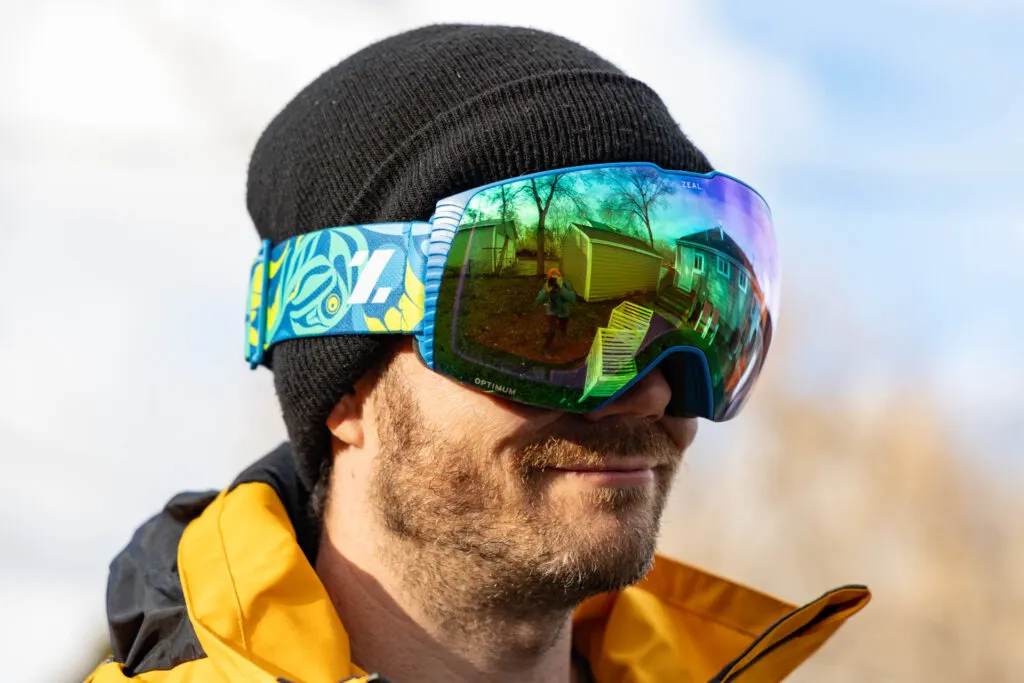 A man wears the Zeal Cloudfall Haa Aani ski sustainable ski goggles.