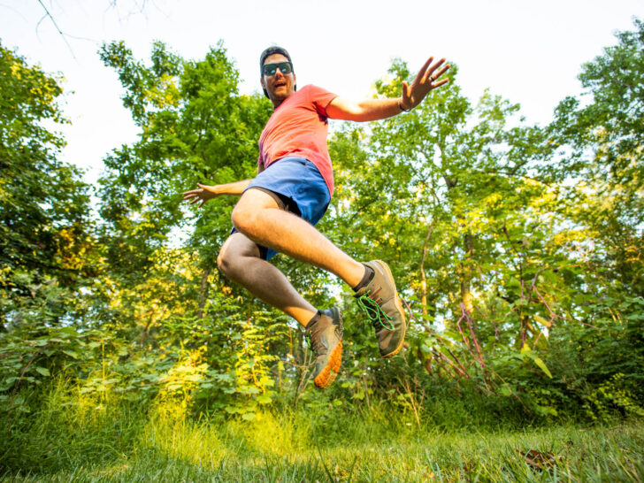 a man jumps for joy in barefoot shoes.