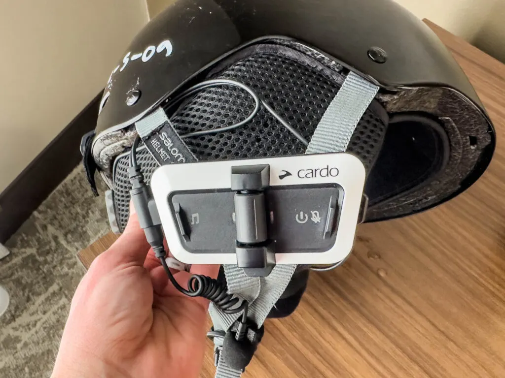 The Packtalk Outdoor attached to a ski helmet.