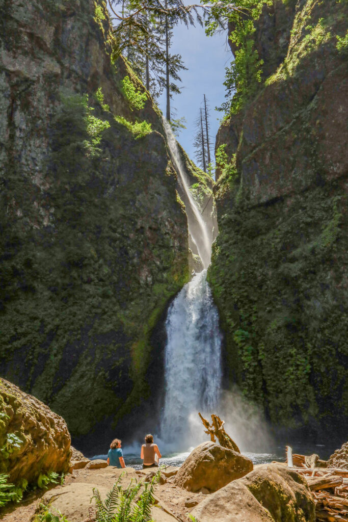 Hikes Near Hood River: Two hikers rest at Wachlella Falls.