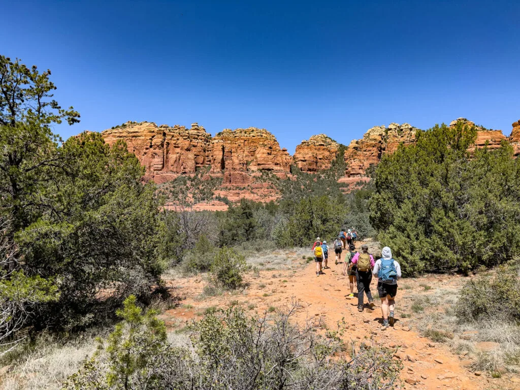 A trail of hikers in Sedona on an REI Adventures guided hiking trip.
