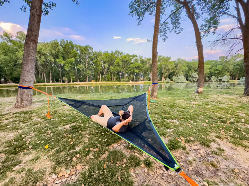 Josh lounging solo in the Tentsile Trillium Mesh hammock.