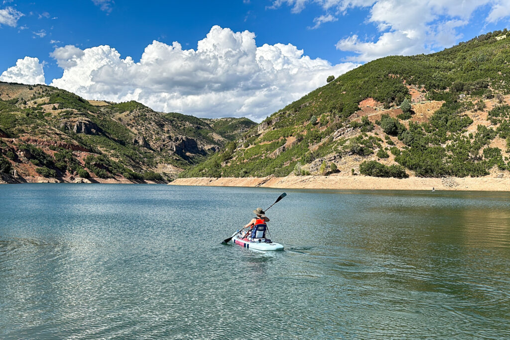 Paddling with the Isle Switch Compact inflatable SUP in kayak mode.