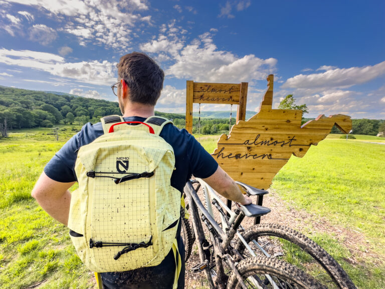 A man wears the Nemo Resolve Endless Promise daypack.