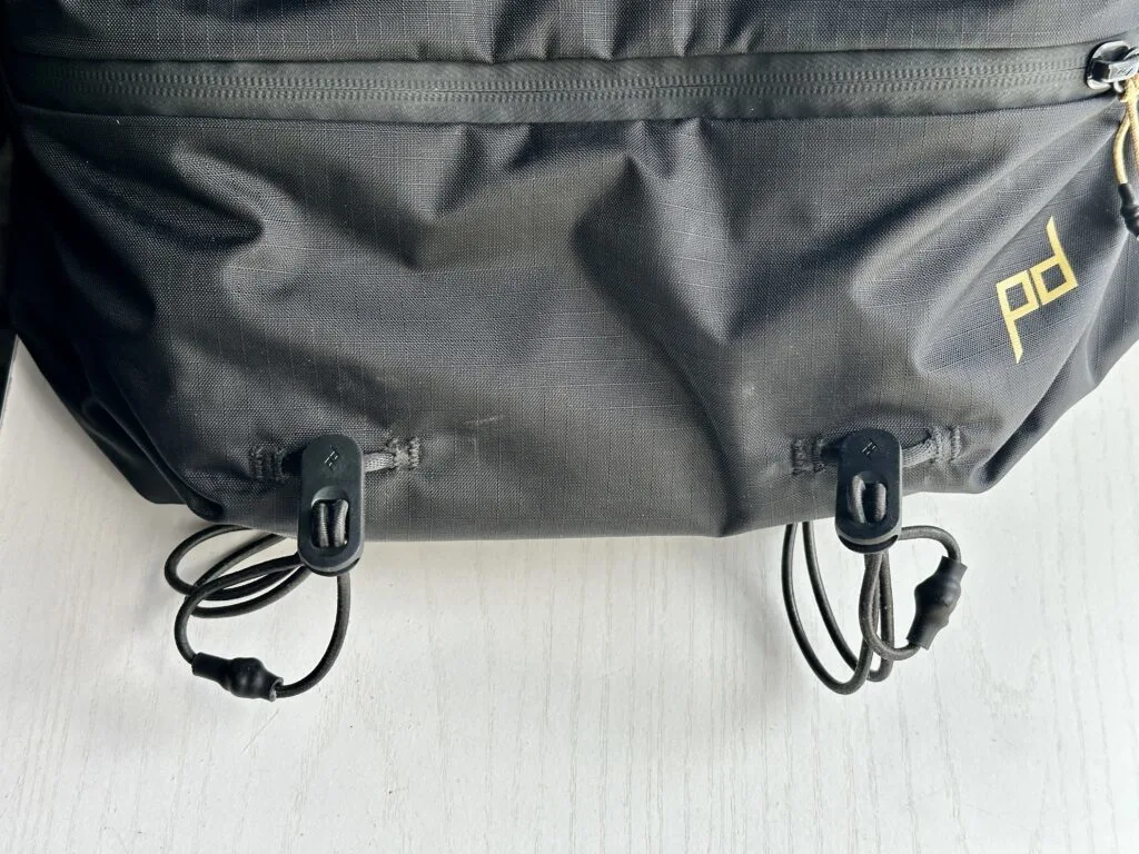 The Peak Design Outdoor Bags 7L Sling exterior cords.