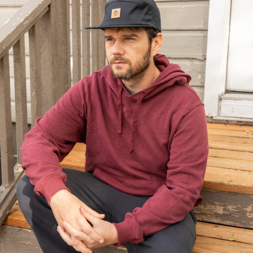 A man wears the Jungmaven Montauk Hoodie.