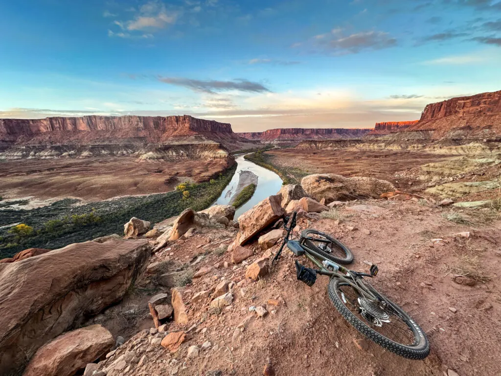 A bike laying on the edge of a canyon along White Rim Trail in Canyonlands National Park.