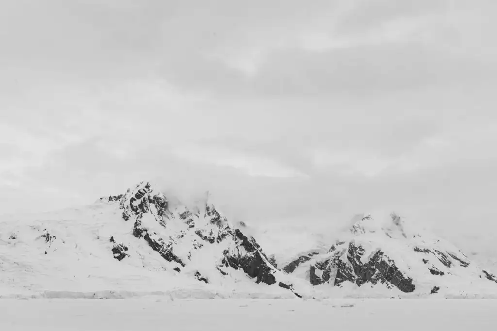 Mountains and sea ice and glaciers in Antarctica.